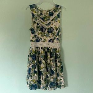 City Studio knee length white dress with yellow and blue flowers, size 5.